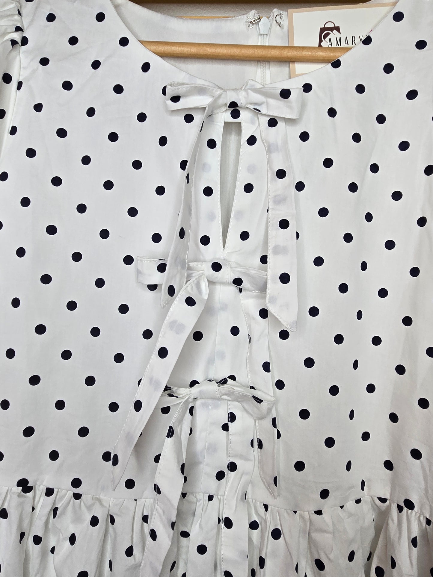 puff sleeve dress, polka dot dress, ruffle hem, front bow, lined dress, classic style, elegant outfit, feminine fashion, lightweight fabric, chic and timeless, amarylisvipboutique, boutiqueonline