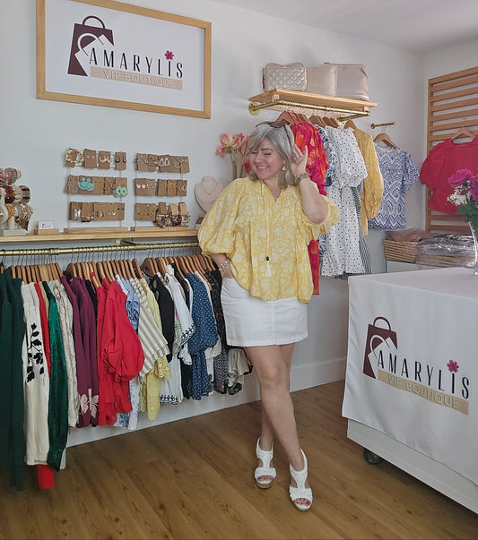 Yellow printed peasant blouse with puffed 3/4 sleeves and a tasseled tie neckline, lightweight and relaxed fit