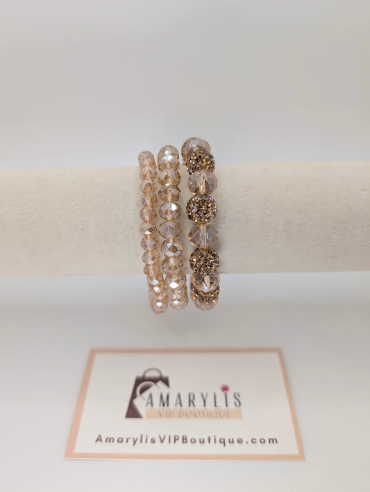 Set of beaded bracelets on a white background with Amarylis VIP Boutique logo.