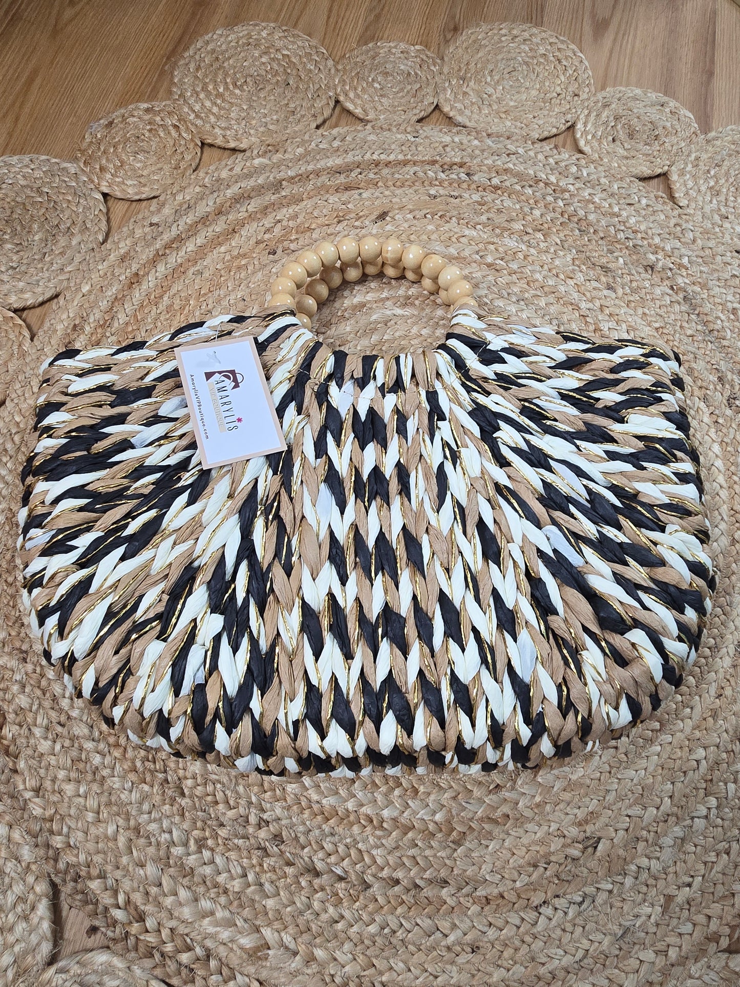 Straw crescent tote bag with round handles and inner lining with drawstring closure