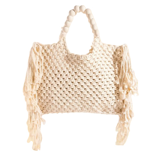 Large woven macrame tote bag with intricate knotted design, long fringe trim, and braided shoulder strap.