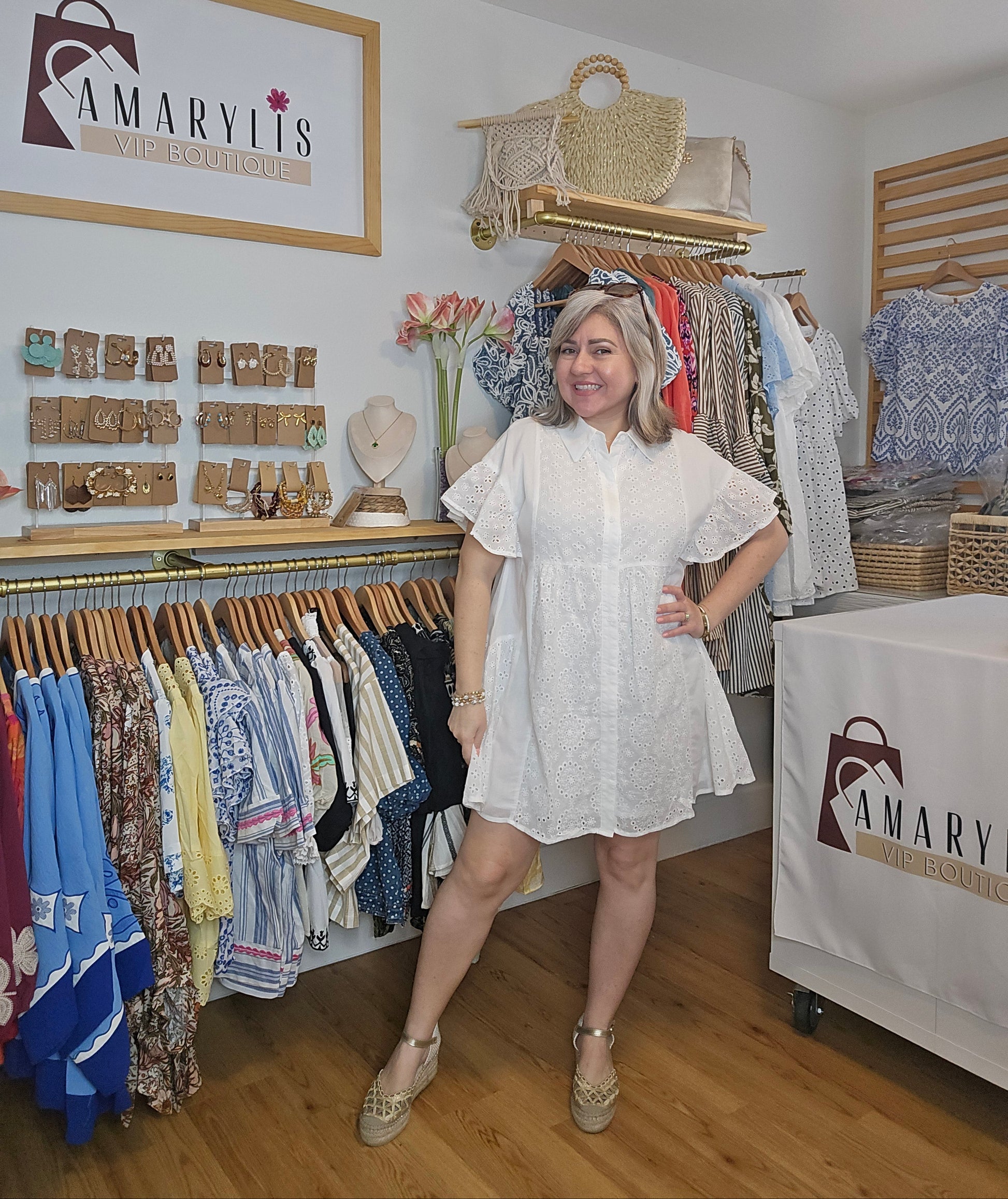 Lightweight shirt dress with eyelet embroidery, button-front closure, short flutter sleeves, and a soft, feminine silhouette.