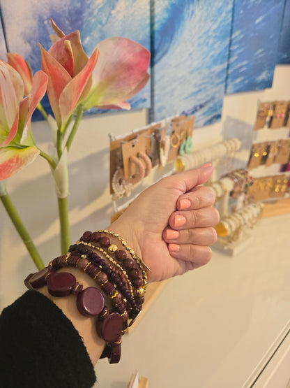 Bohemian-inspired set of 7 assorted abstract beaded bracelets.