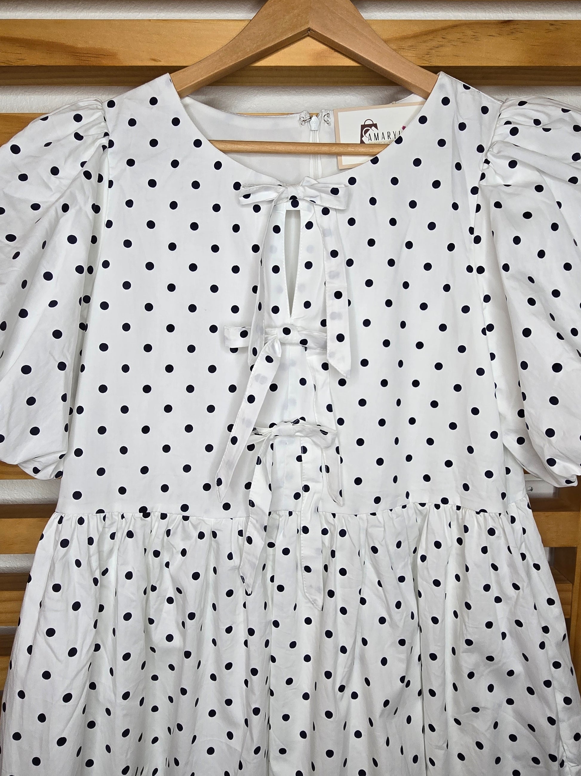 puff sleeve dress, polka dot dress, ruffle hem, front bow, lined dress, classic style, elegant outfit, feminine fashion, lightweight fabric, chic and timeless, amarylisvipboutique, boutiqueonline