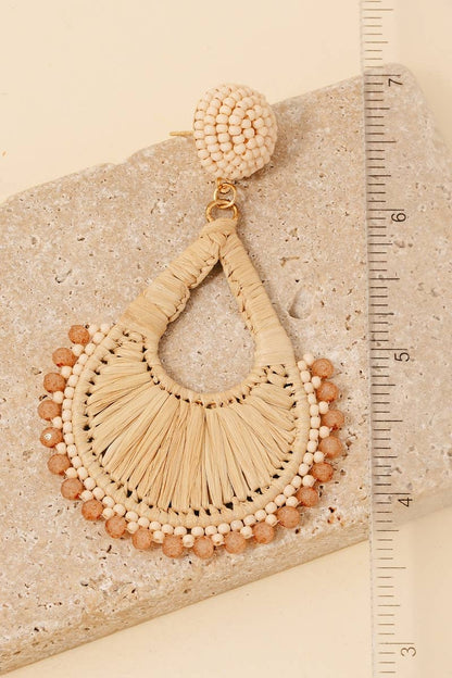 Braided teardrop dangle earrings featuring intricate bead accents and an elegant lightweight design.
