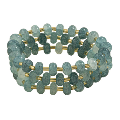 Triple stretch bracelet featuring synthetic marbled stone beads with soft veining and metallic tube accents.