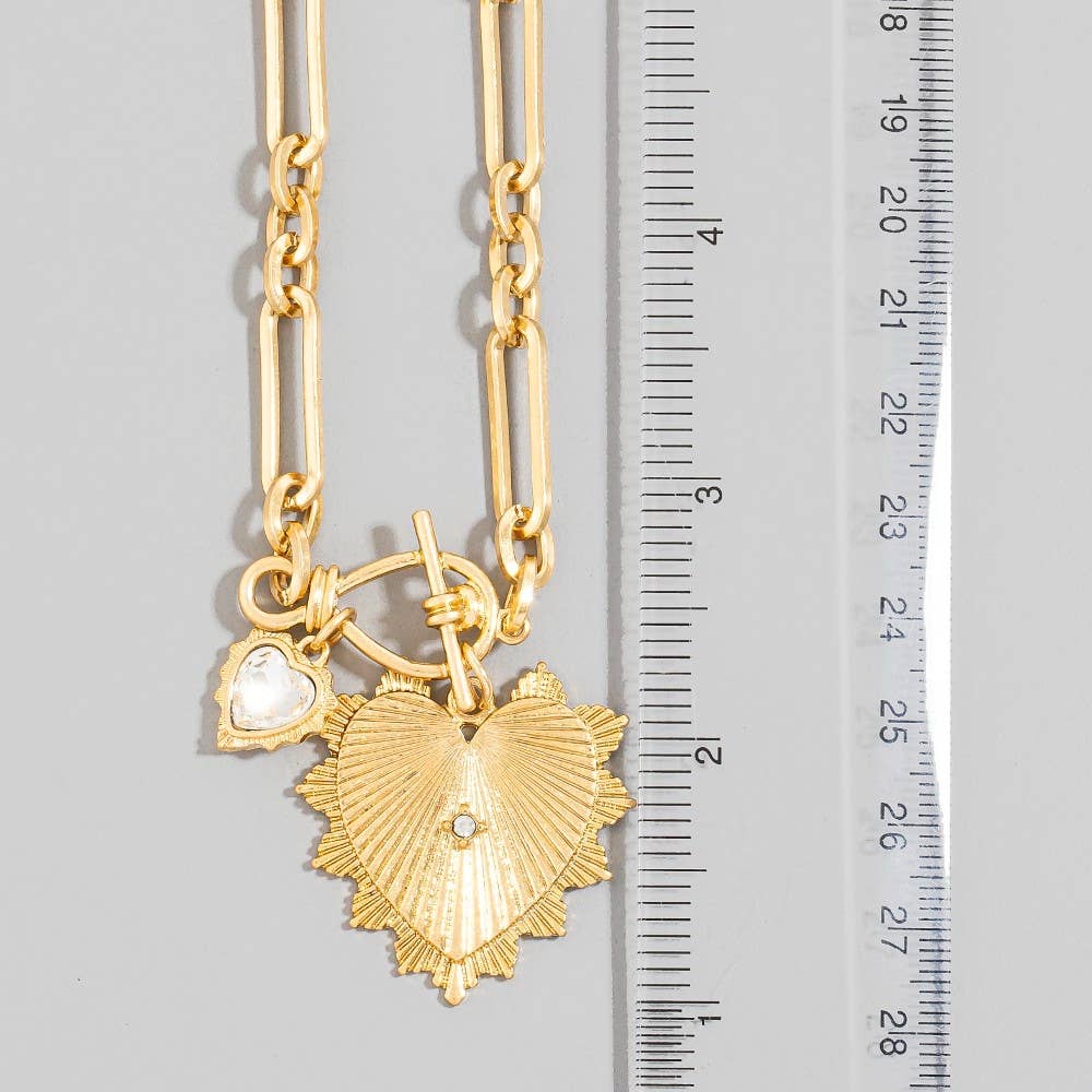 Double heart oval link chain necklace featuring an elegant and feminine design with delicate heart accents and polished chain links.