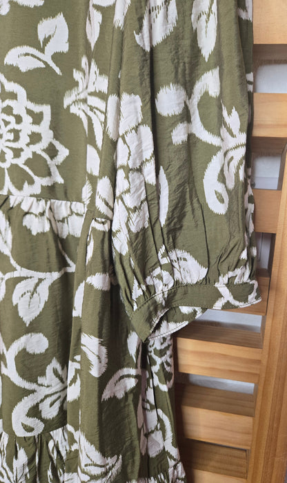 boho dress, floral dress, olive dress, white flowers, 3/4 sleeves, babydoll dress, loose fit, comfy dress, dress with pockets, tassel dress, feminine style, casual boho, relaxed look, soft fabric, everyday dress, amarylisvipboutique, amarylis