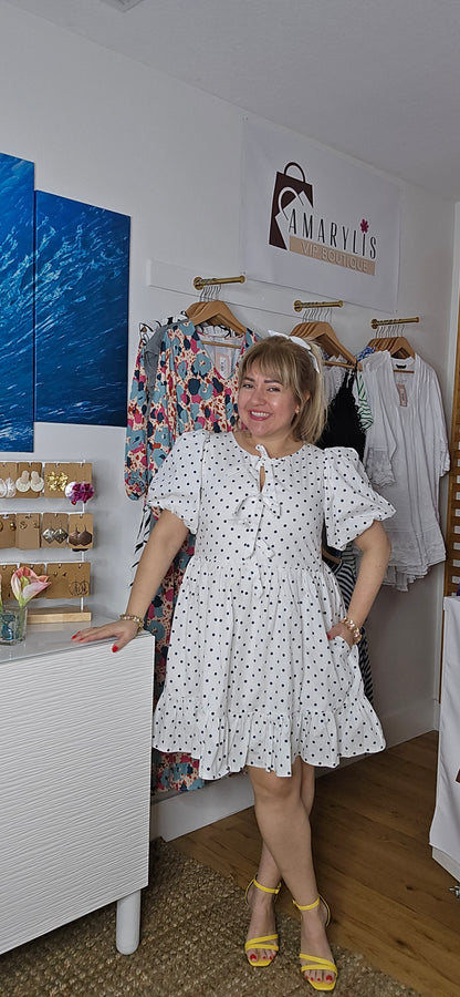puff sleeve dress, polka dot dress, ruffle hem, front bow, lined dress, classic style, elegant outfit, feminine fashion, lightweight fabric, chic and timeless, amarylisvipboutique, boutiqueonline
