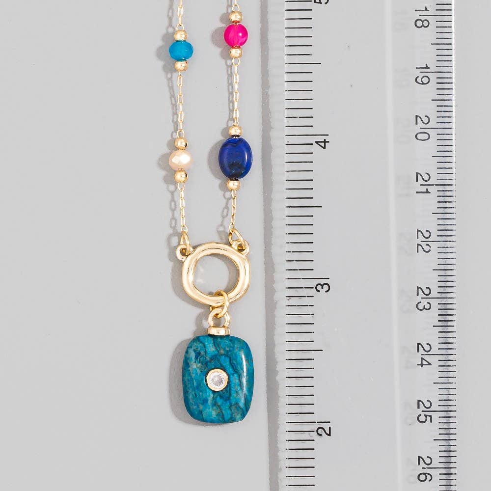 Multicolor gemstone pendant necklace featuring a delicate chain and an elegant pendant design, perfect for adding a sophisticated touch to everyday and special occasion looks.