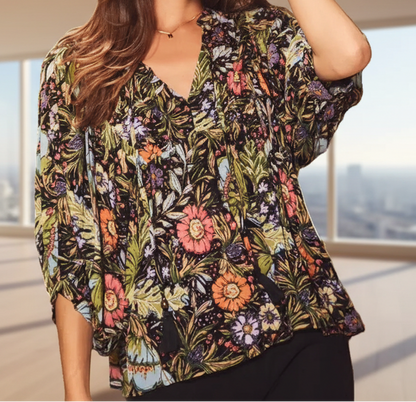 Floral bohemian peasant blouse with 3/4 puff sleeves and tassel tie neckline