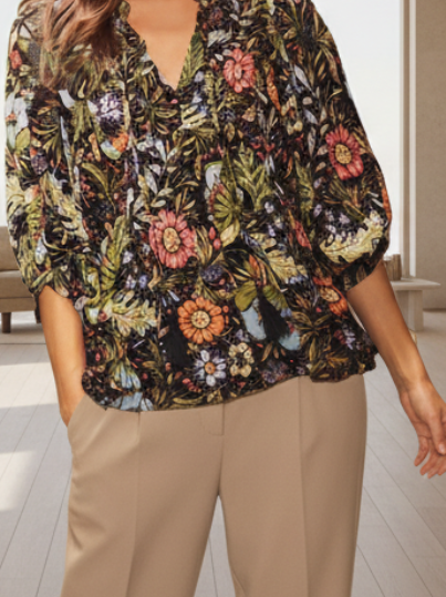 Floral bohemian peasant blouse with 3/4 puff sleeves and tassel tie neckline