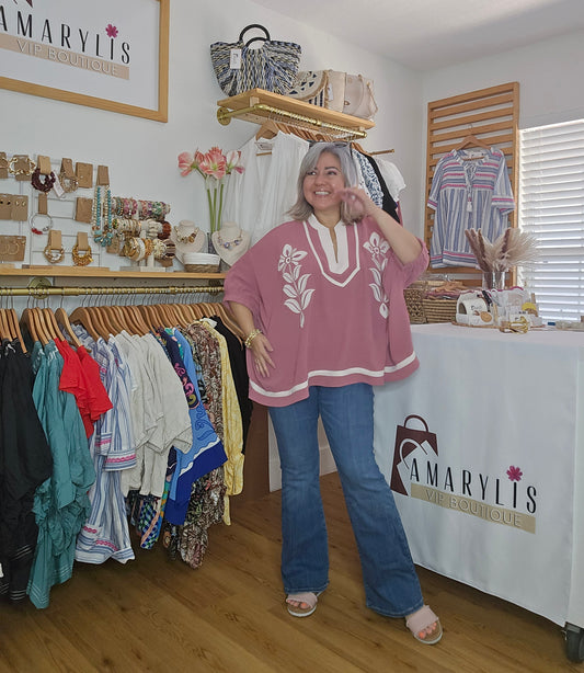 Women's dusty rose embroidered blouse featuring floral embroidery, contrast striped rib trim, short sleeves, and a relaxed fit.