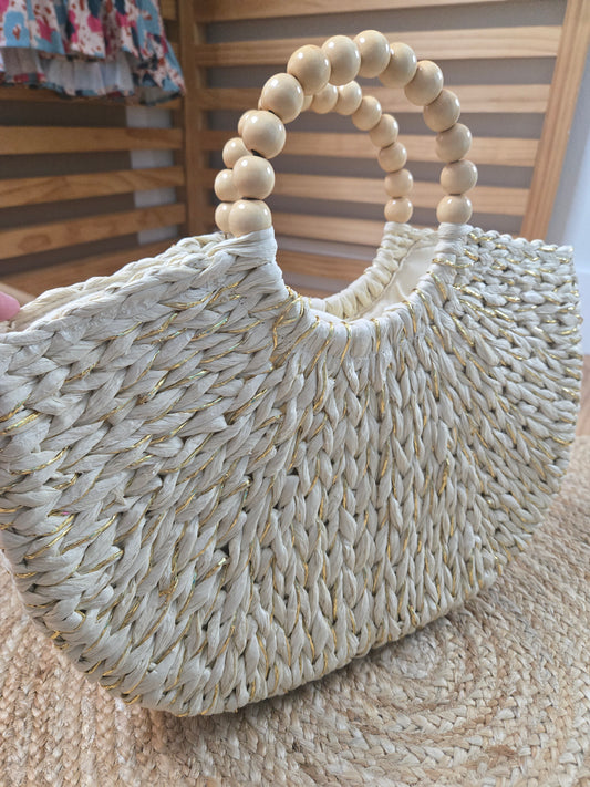 Straw crescent tote bag with round handles and inner lining with drawstring closure