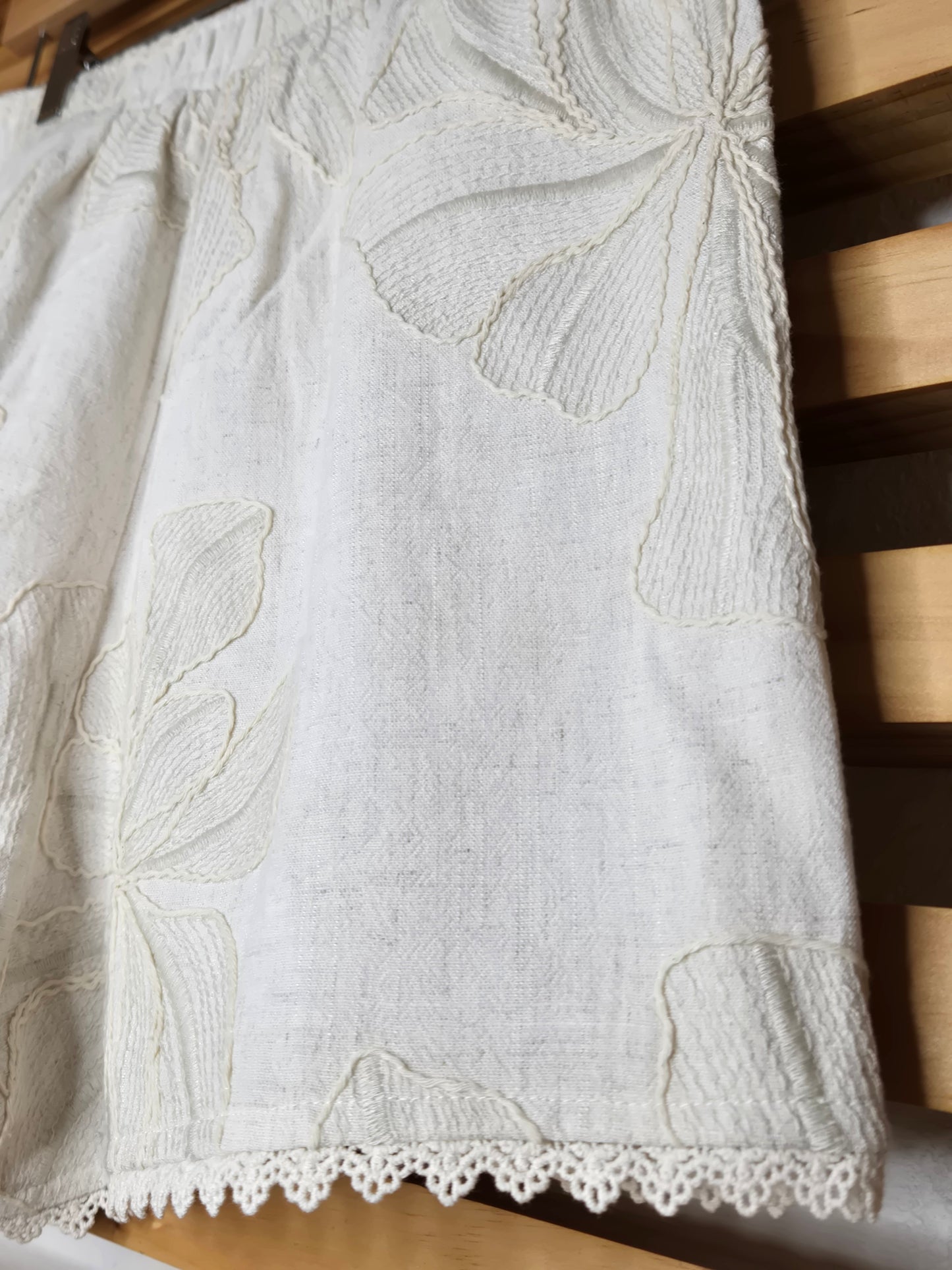 Beige embroidered shorts featuring delicate floral embroidery, crochet lace trim, side pockets, and a comfortable elastic waistband. Styled with the matching embroidered top, sold separately.