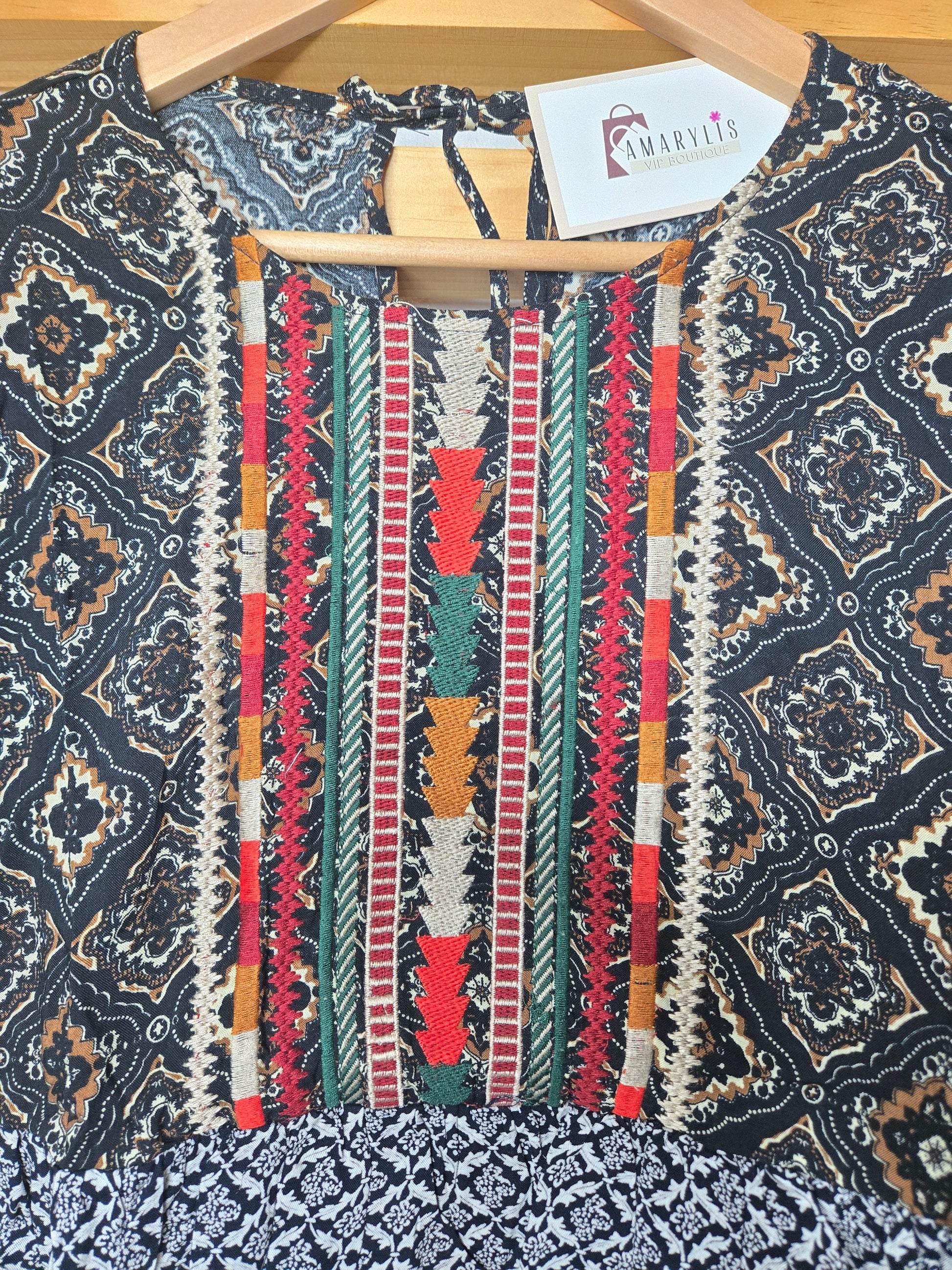 This piece is perfect for lovers of boho embroidered tops, mixed print blouses, and romantic bohemian clothing. A versatile short sleeve boho top designed for women who appreciate feminine, effortless style.