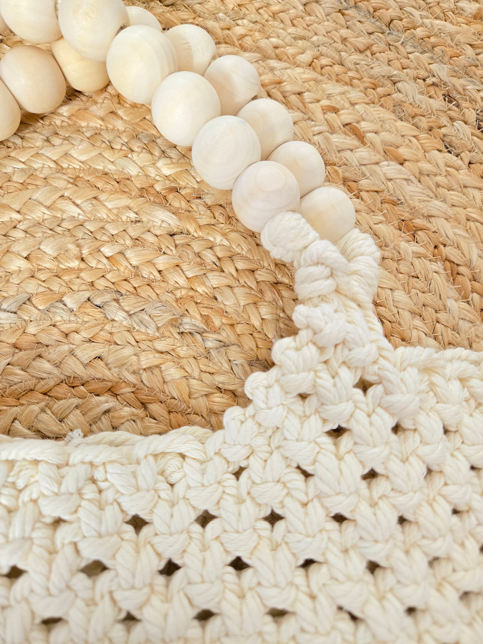 Large woven macrame tote bag with intricate knotted design, long fringe trim, and braided shoulder strap.