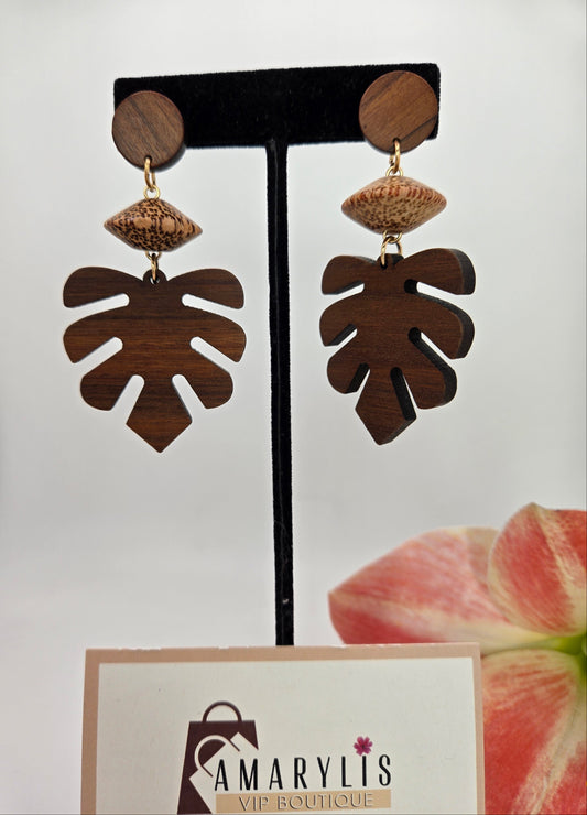 Natural wooden monstera leaf dangle earrings featuring an intricate cutout leaf design with lightweight dangling hooks.