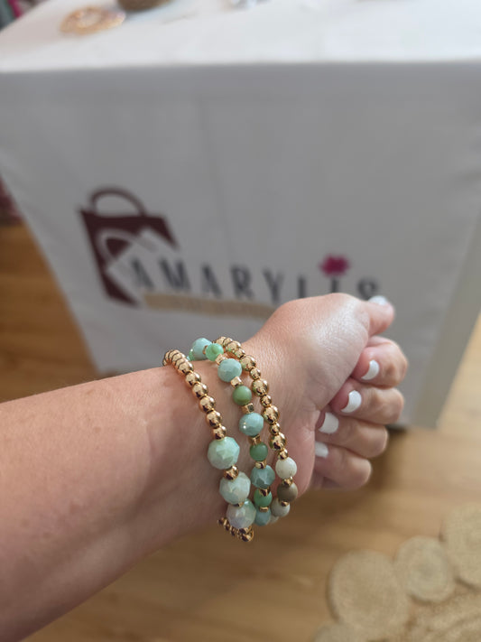 Set of mint green faceted stone stretch bracelets with gold-tone beads