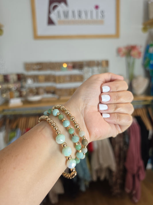 Set of mint green faceted stone stretch bracelets with gold-tone beads