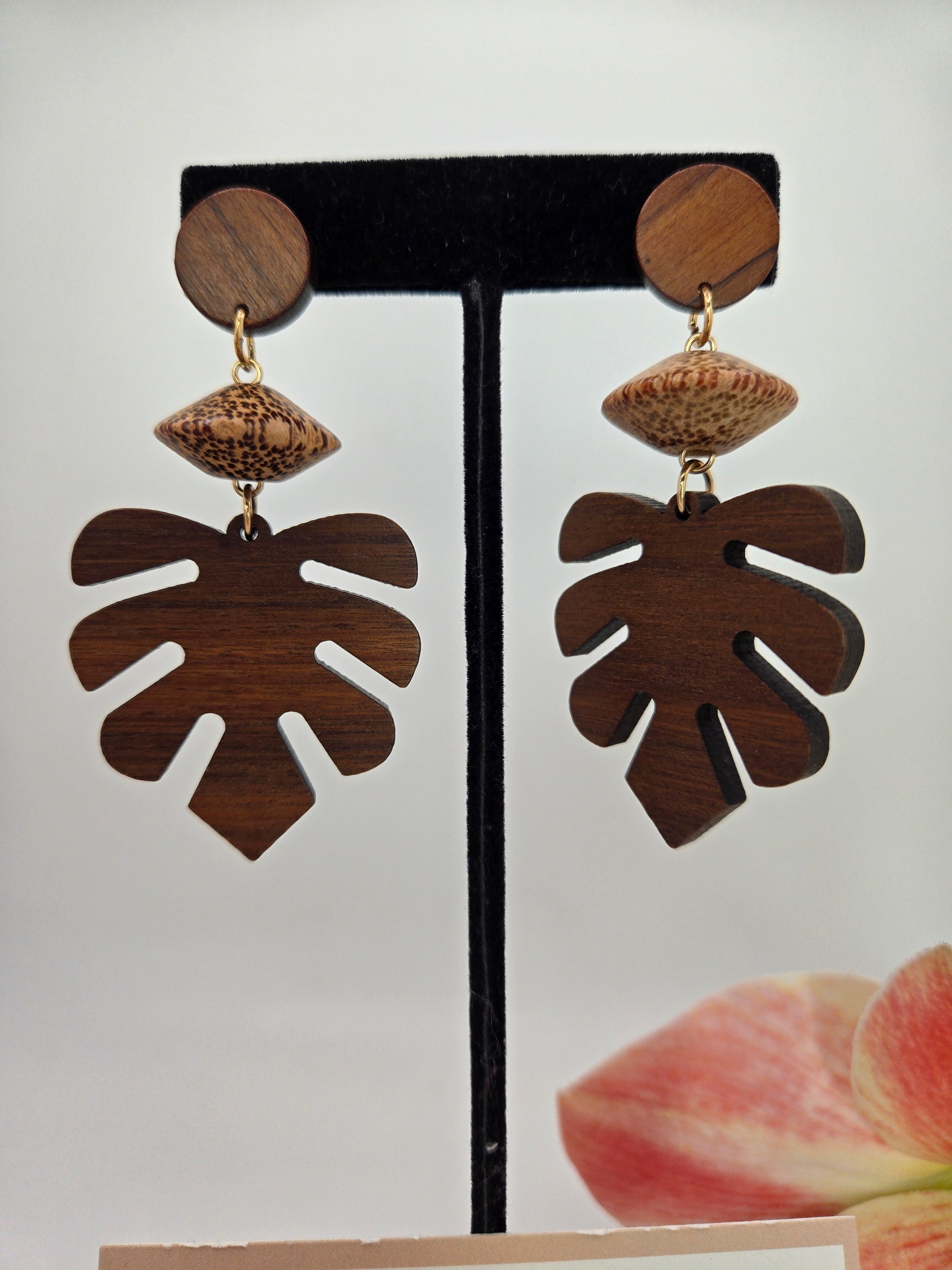Natural wooden monstera leaf dangle earrings featuring an intricate cutout leaf design with lightweight dangling hooks.