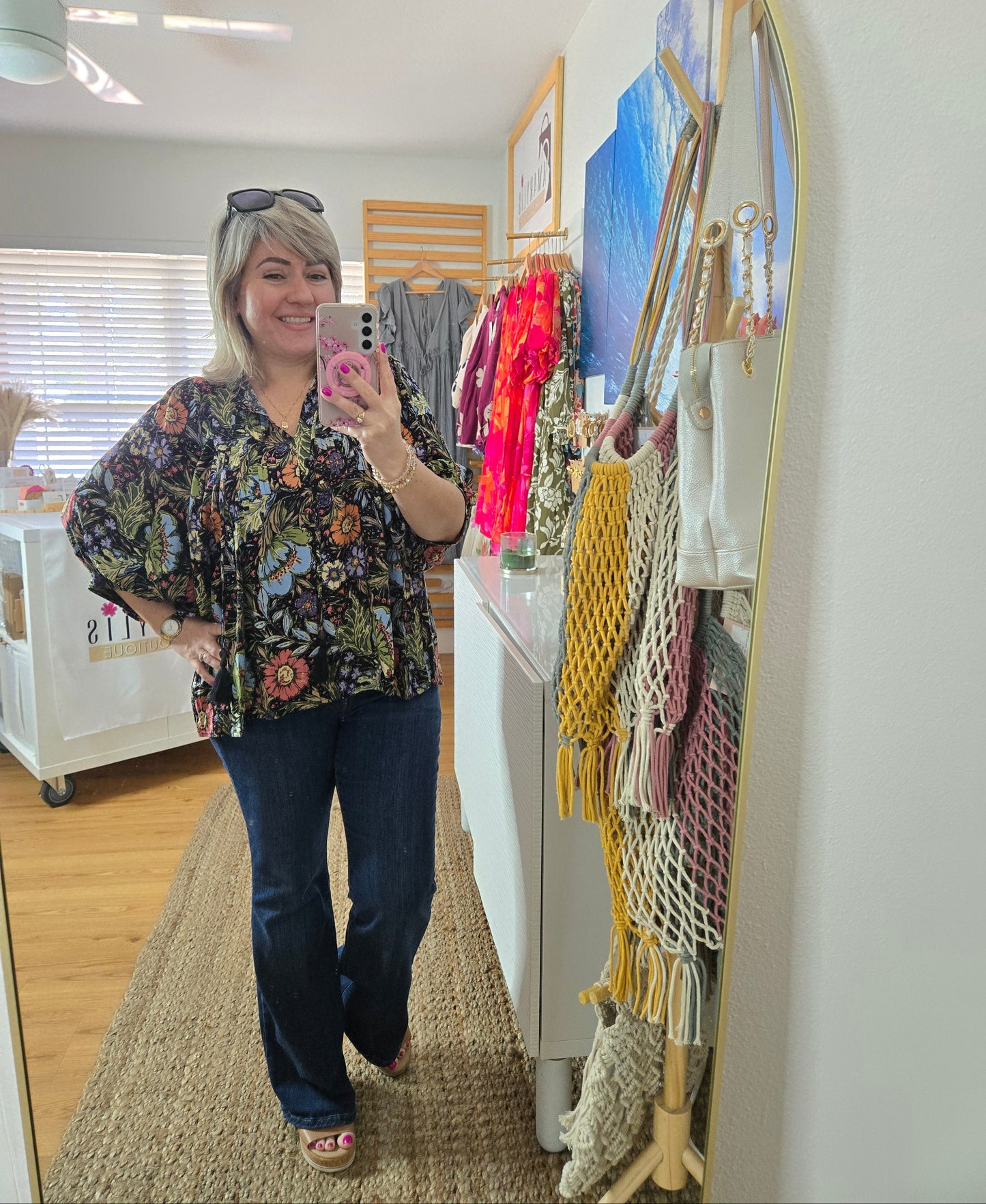 Soft and feminine peasant-style blouse featuring a delicate floral print, 3/4 length puff sleeves, and a tassel-tie neckline. Designed for effortless bohemian looks, this blouse offers a relaxed fit that feels comfortable yet polished and romantic.