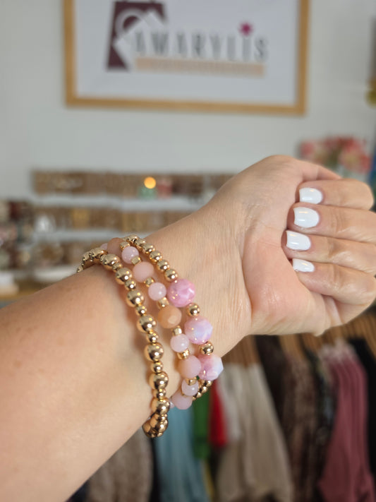 Set of pink faceted stone stretch bracelets with gold-tone beads