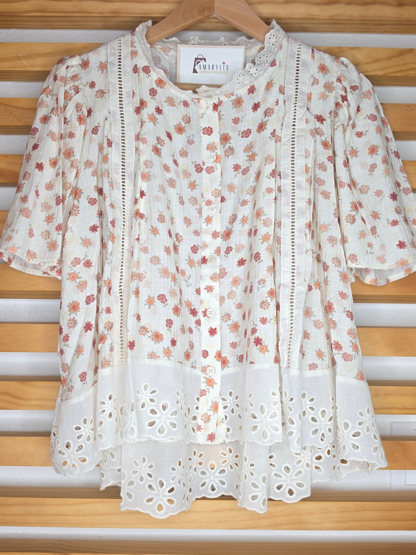 Floral print blouse with lace trim, flutter sleeves, and button-front closure