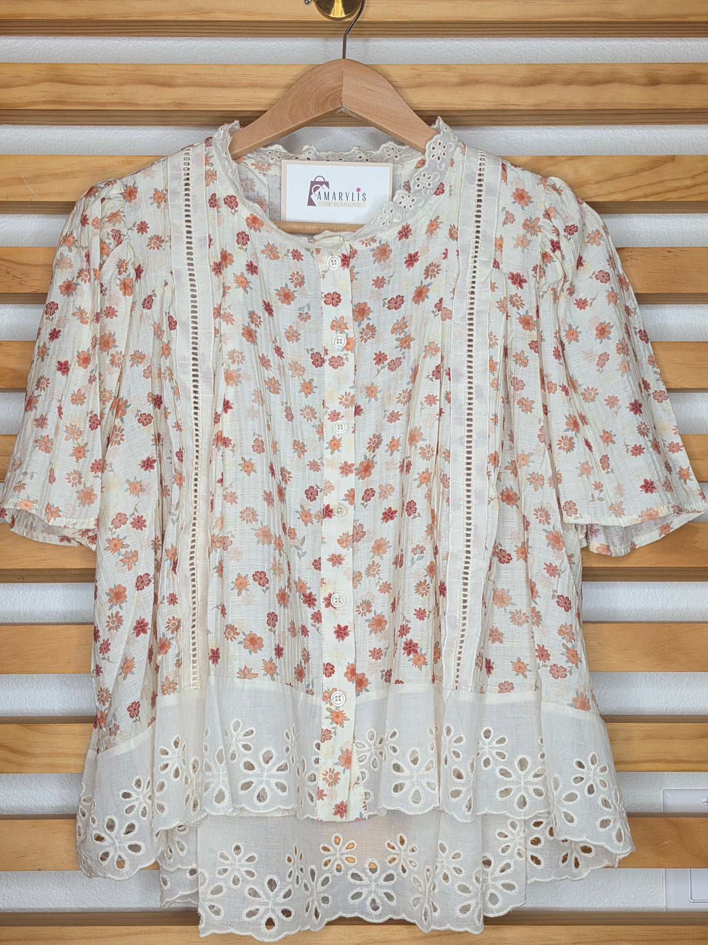 Floral print blouse with lace trim, flutter sleeves, and button-front closure