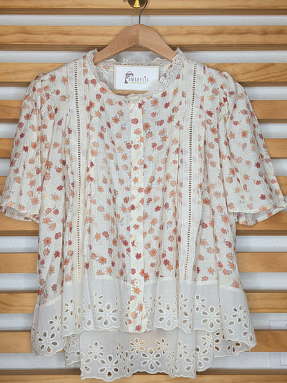 Floral print blouse with lace trim, flutter sleeves, and button-front closure