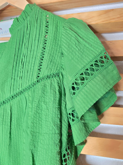Designed with a flattering V-neckline, delicate lace accents, and soft short sleeves, this versatile piece combines comfort with timeless style. The lightweight fabric and relaxed silhouette make it easy to pair with jeans, shorts, skirts, or dress pants for both casual outings and polished everyday looks.