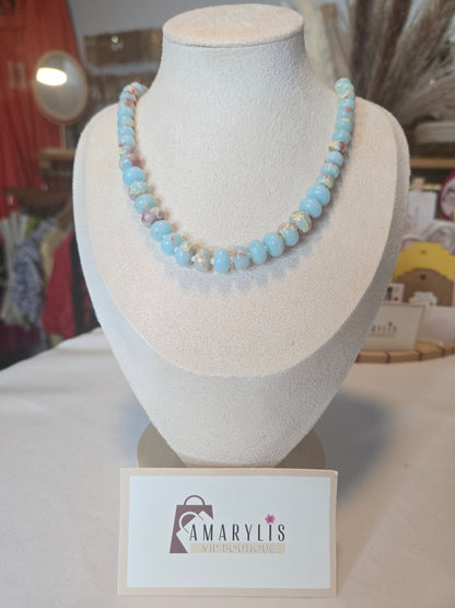Semi-precious gemstone necklace featuring smooth sky-blue rondelle beads with natural brown matrix accents and delicate spacer beads.