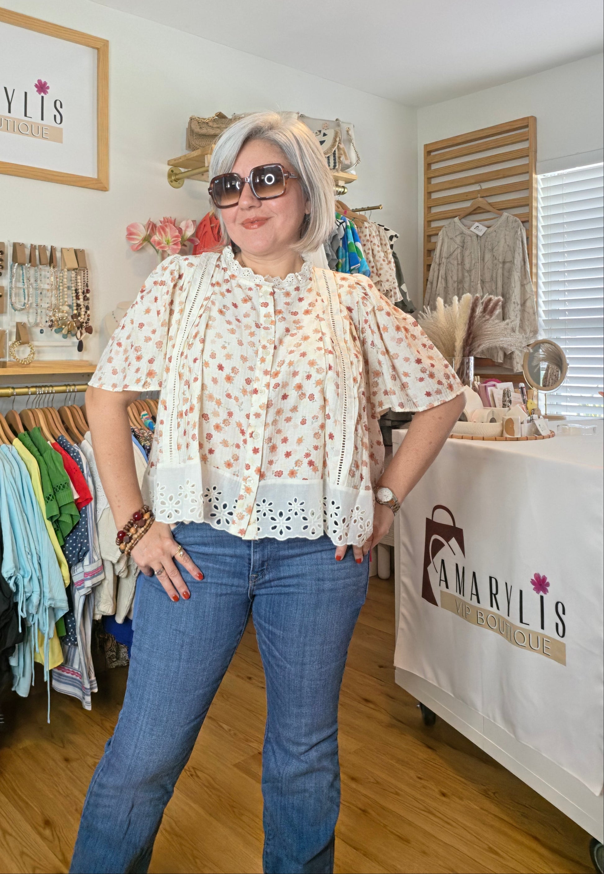 Floral print blouse with lace trim, flutter sleeves, and button-front closure