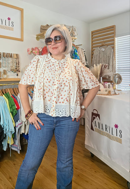 Floral print blouse with lace trim, flutter sleeves, and button-front closure
