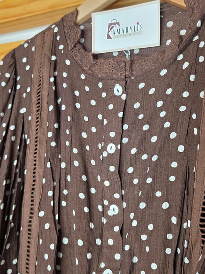 Women's polka dot blouse with scalloped lace neckline, vertical lace inserts, flowing sleeves, button-front closure, and wide eyelet lace hem
