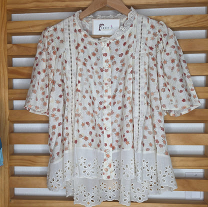 Floral print blouse with lace trim, flutter sleeves, and button-front closure