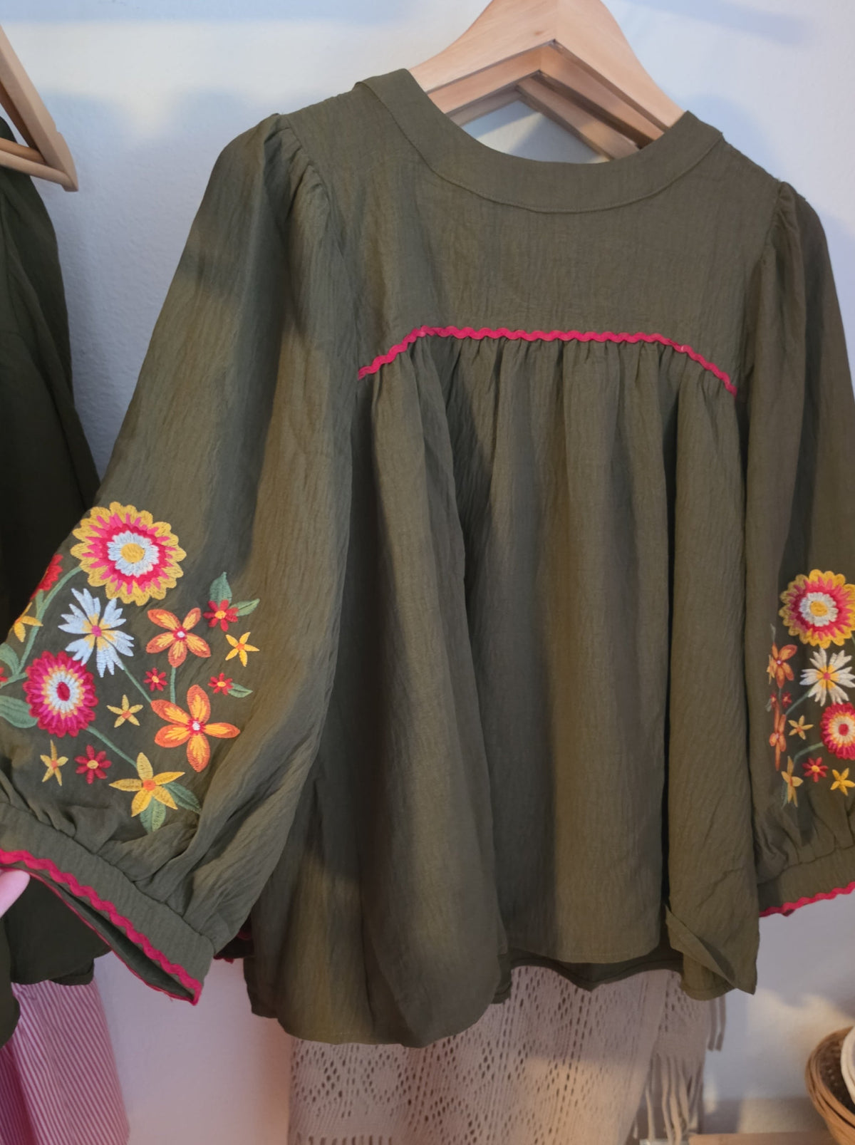 Women's boho blouse with embroidered sleeves and contrasting zigzag trim