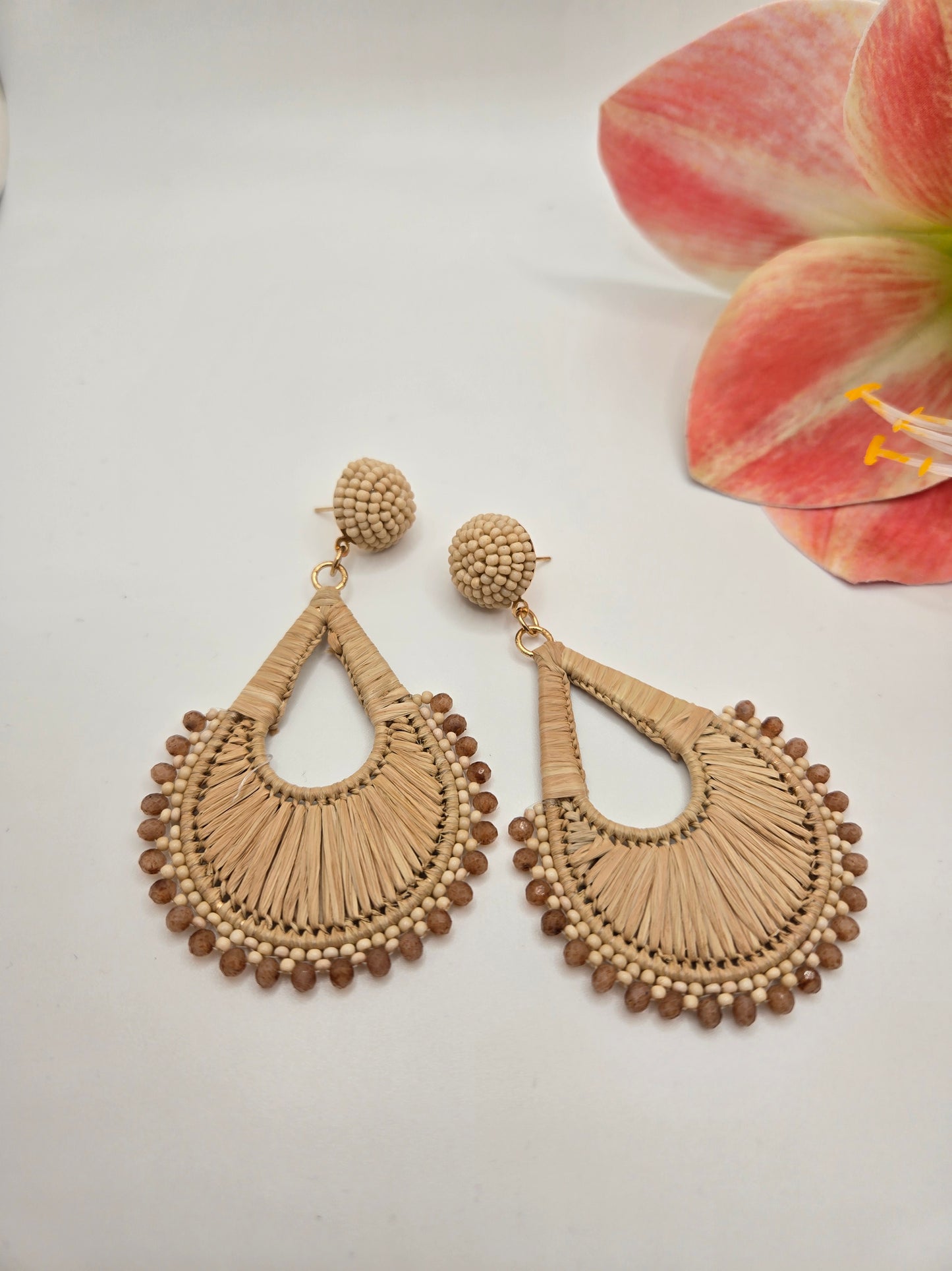Braided teardrop dangle earrings featuring intricate bead accents and an elegant lightweight design.