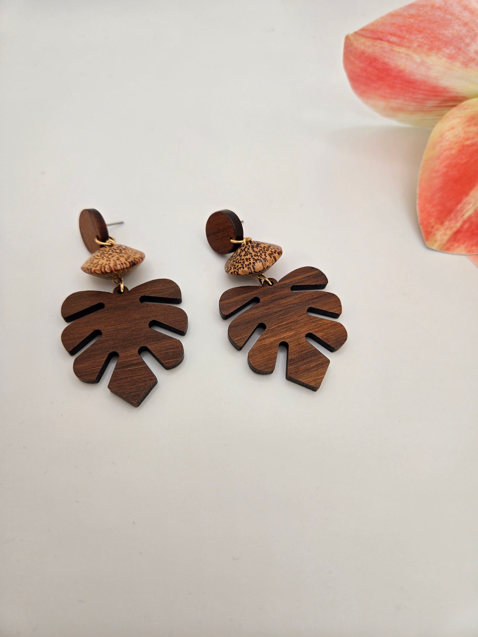 Natural wooden monstera leaf dangle earrings featuring an intricate cutout leaf design with lightweight dangling hooks.