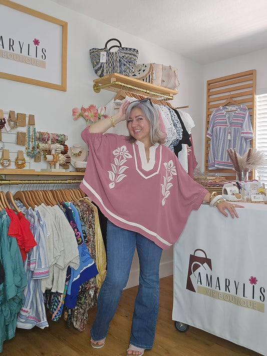 Women's dusty rose embroidered blouse featuring floral embroidery, contrast striped rib trim, short sleeves, and a relaxed fit.