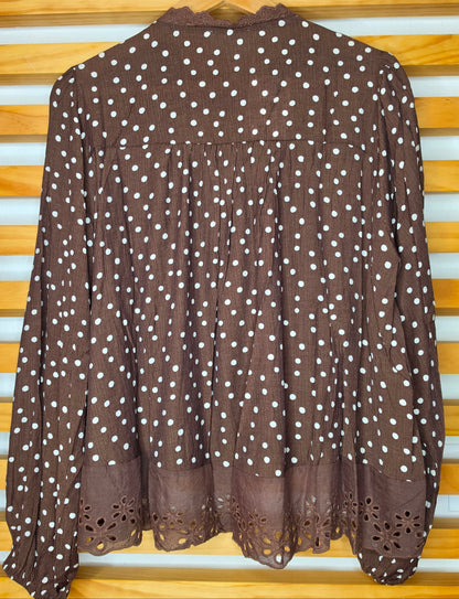 Women's polka dot blouse with scalloped lace neckline, vertical lace inserts, flowing sleeves, button-front closure, and wide eyelet lace hem